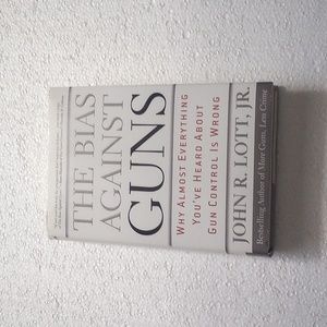 Book: The Boss Against Guns. Author: John R. Lott, JR
